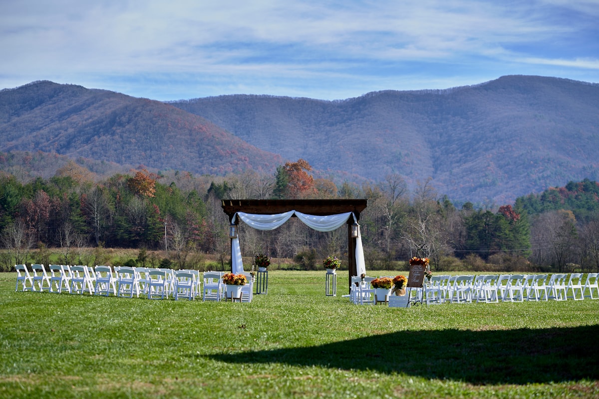Acoustic guitar player performing at outdoor mountain wedding ceremony