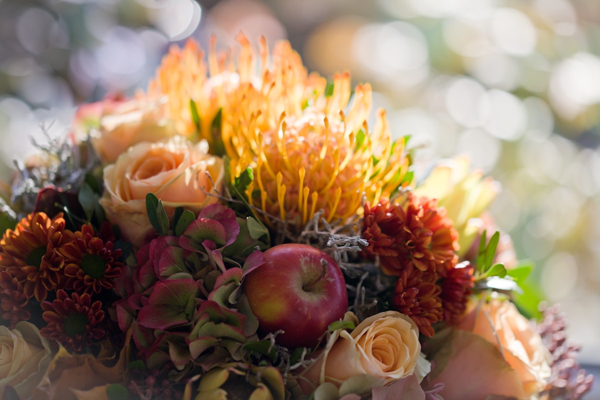 Autumn wedding dance floor under aspens turning gold at an outdoor venue outside Whitefish