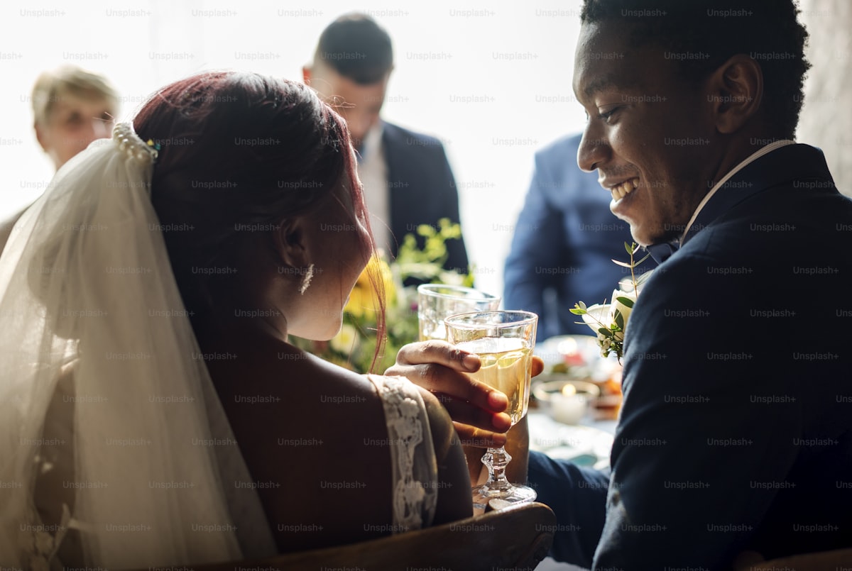 Bride and Groom Clinking Glasess Wedding Reception