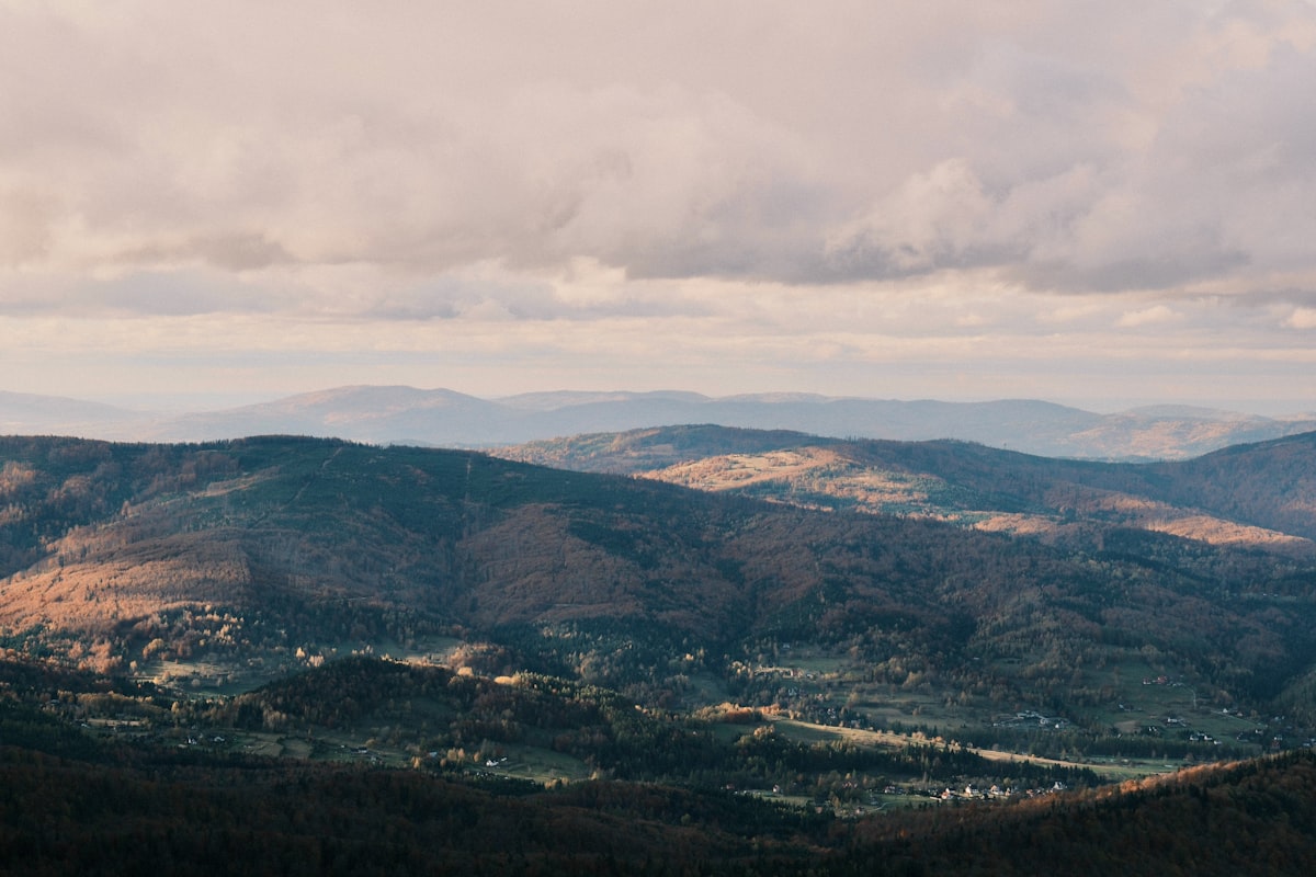Rolling hills and valleys under a cloudy sky