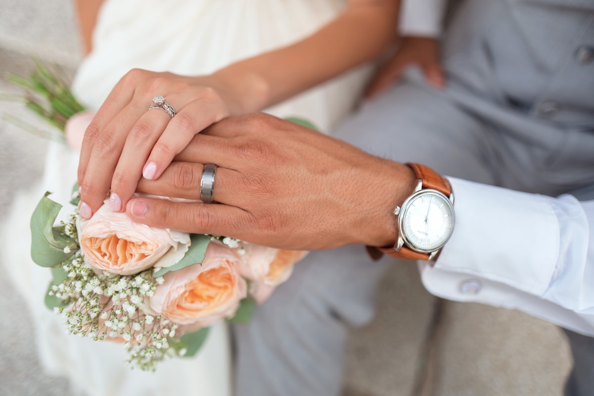 Couple sharing a sunset vow exchange at a Big Sky elopement with mountains in the distance