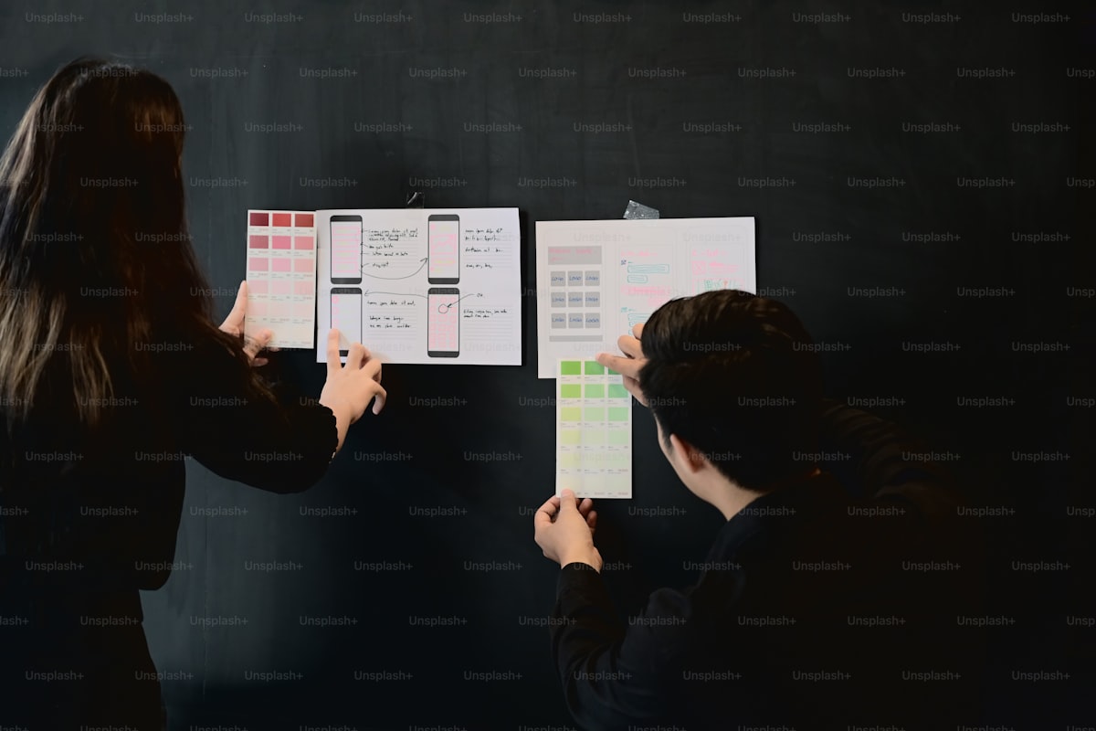 Couple planning their wedding timeline with calendar and notes