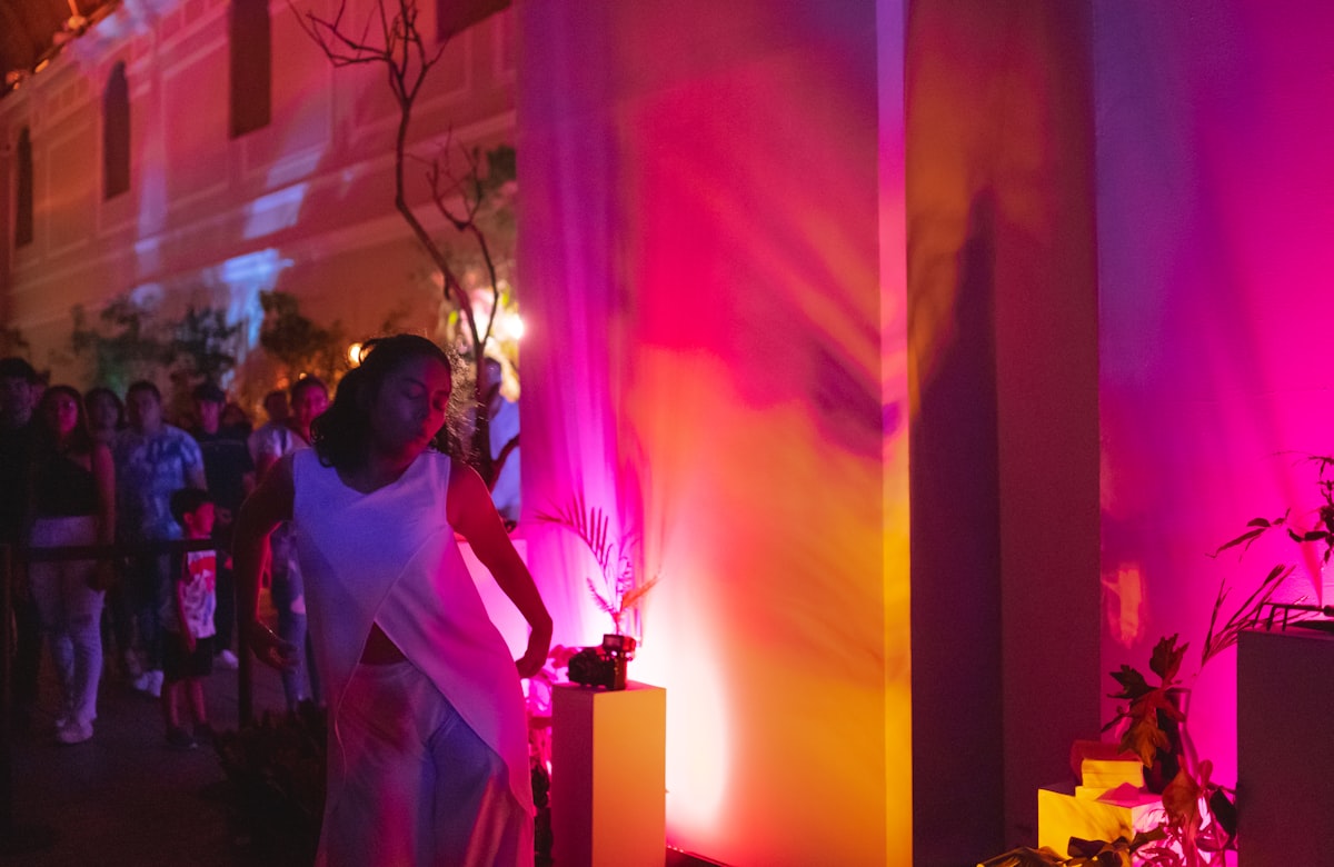 Guest dancing under a saturated color wash during a Missoula wedding reception