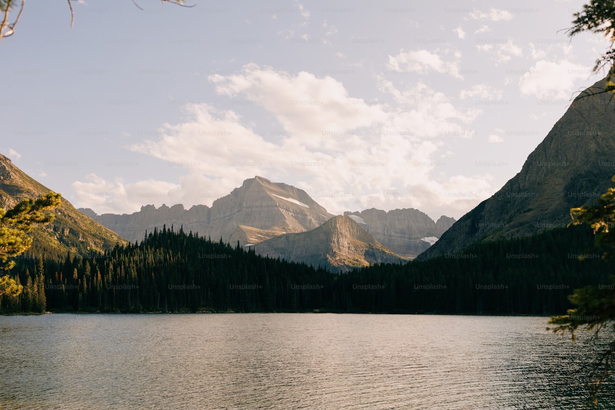 Wedding ceremony setup in Glacier National Park with mountain backdrop and lake views