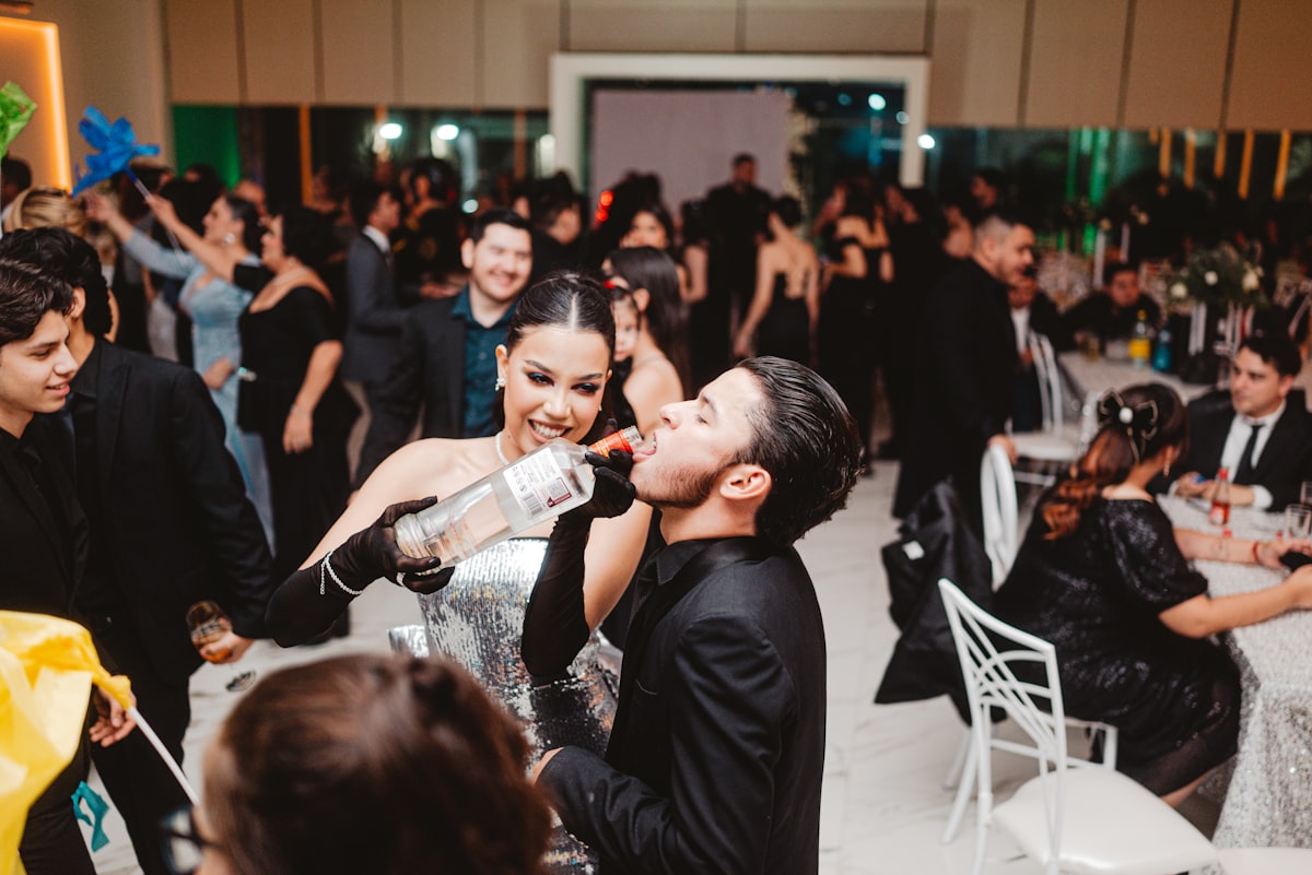 People celebrating at a formal event with drinks