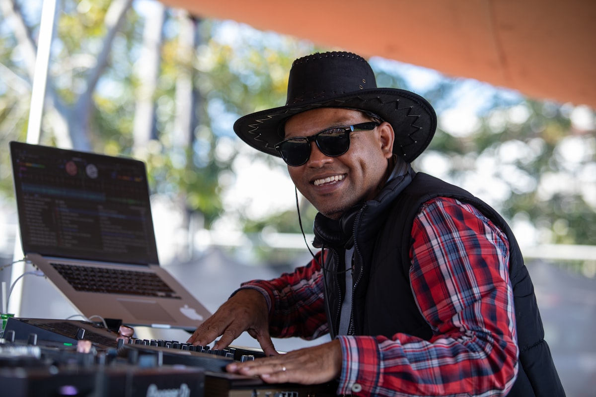 DJ performing at an outdoor summer wedding near Kalispell Montana managing heat and sun exposure for sound equipment