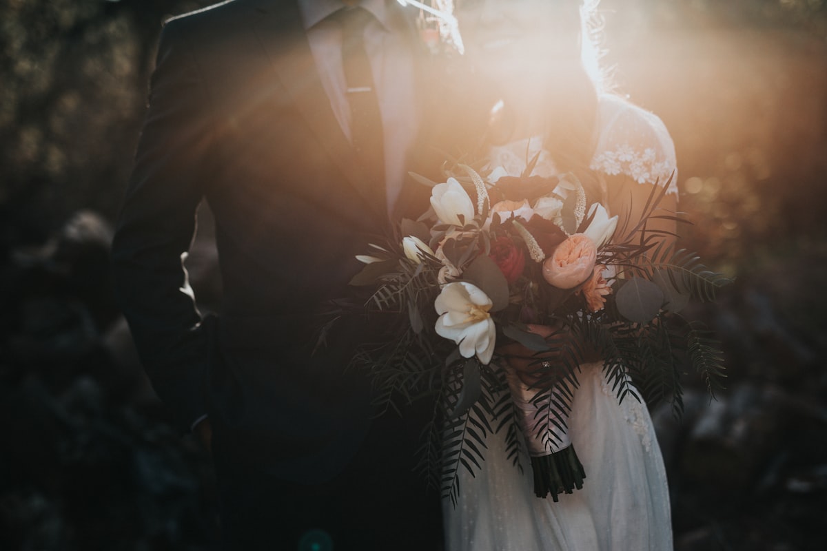 Intimate reception table setup at a remote Livingston ranch with warm candlelight and wildflowers