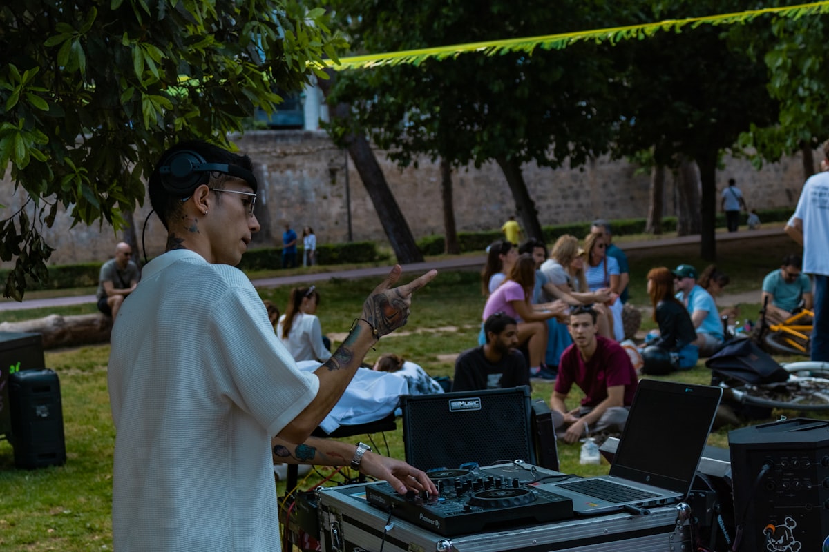 DJ playing music and managing sound system at an outdoor wedding gathering in Missoula Montana