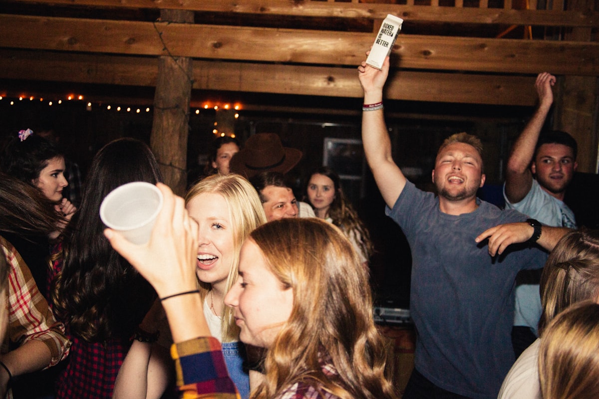 Wedding guests dancing at Montana barn reception with professional lighting and sound