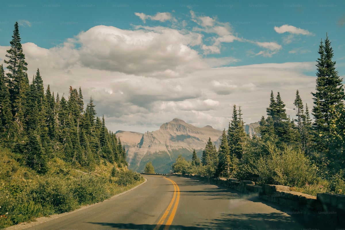 Rental car on winding Montana mountain road to wedding venue