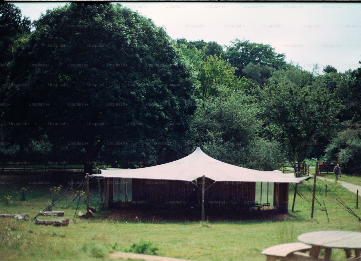 Wedding sound equipment protected under tent from rain at outdoor Montana ceremony