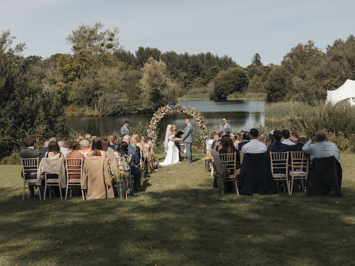 Lakeside wedding ceremony seating during a sound check at a Paradise Valley venue near the water