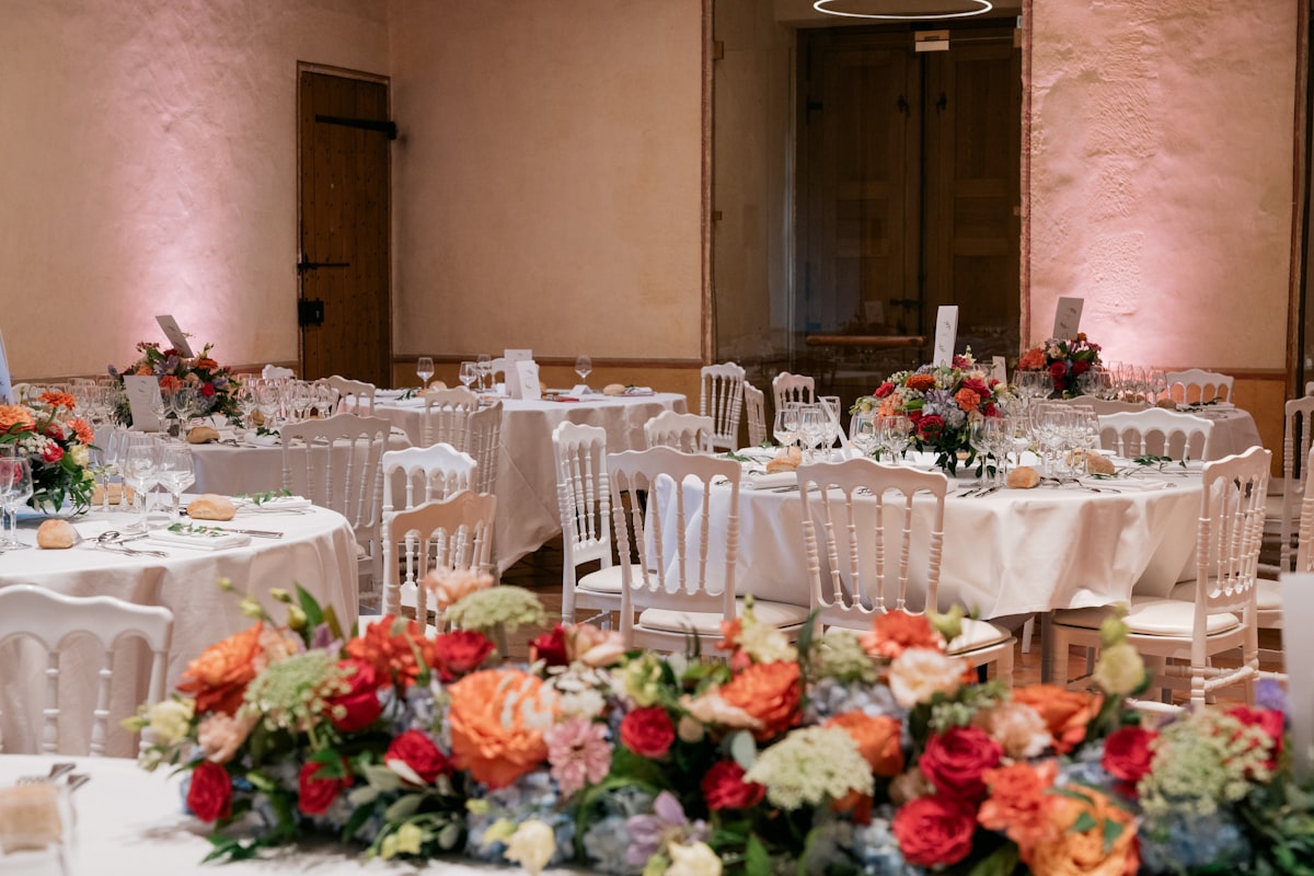 Wedding reception tables with floral centerpieces