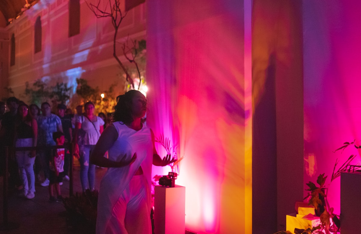 Pink and gold lighting over guests mingling at a Flathead Valley celebration