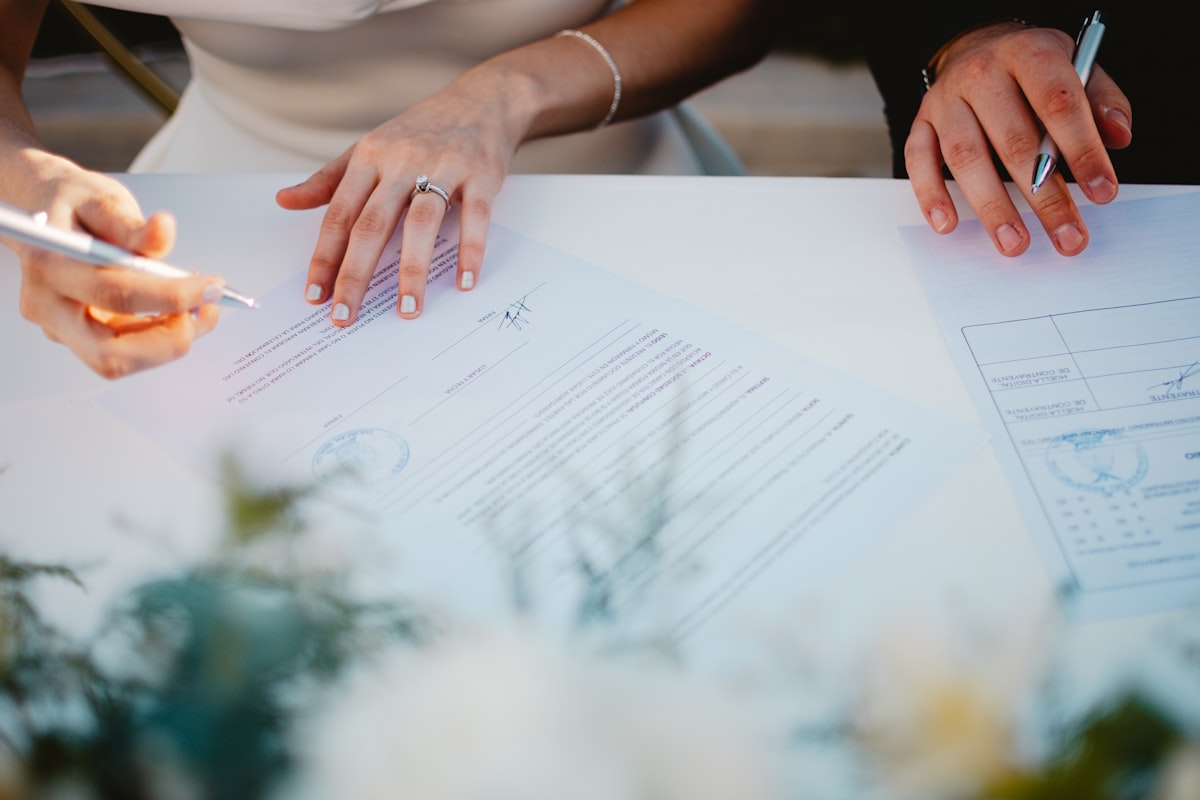Wedding DJ meeting with couple during planning consultation to discuss music and timeline